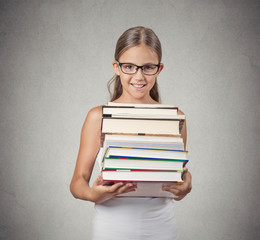 teenager girl student holding pile of books grey background 