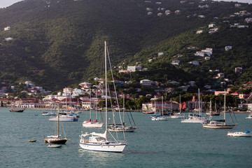 Fototapeta na wymiar Yachts and Sailboats by Green Hills of St Thomas
