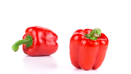 Two ripe red bell peppers.