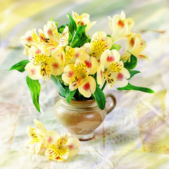 beautiful yellow flowers in a flower pot on a table.