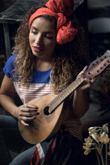 Young girl with a guitar.
