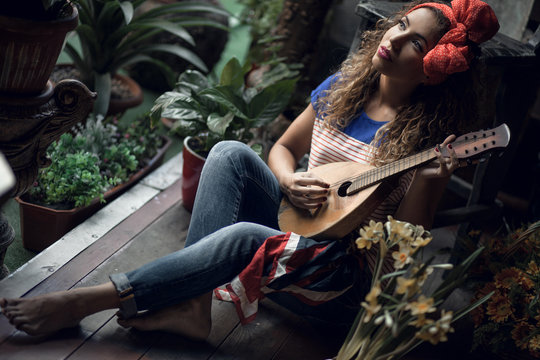 Young girl with a guitar.