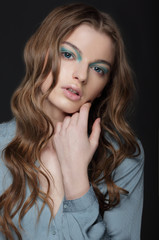 Fantasy. Young Brunette with Unusual Blue Eye Make-up