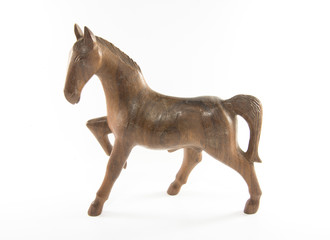 wooden horse is on a white background 