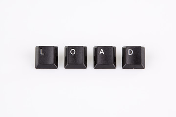 load word written with black computer buttons over white