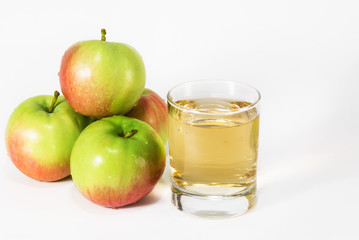 Glass with juice and apples