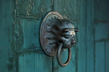 Antique door handle in the form of a lion