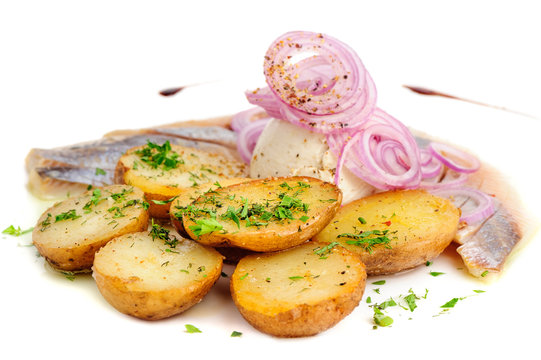 Roast potatoes with hering and onion
