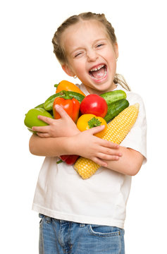 little girl with fruits and vegetables on white