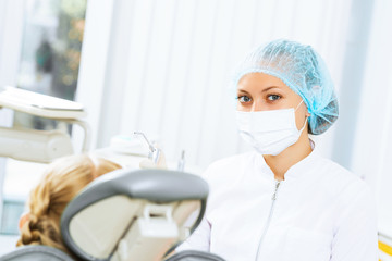 Dentist inspecting patient