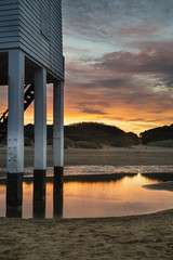 Beautiful landscape sunrise stilt lighthouse on beach