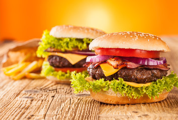 Fresh hamburgers on wooden planks