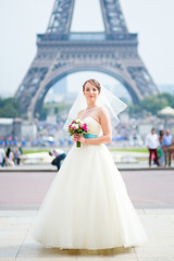 Happy young beautiful bride in Paris