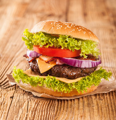 Fresh hamburger on wooden planks