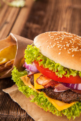 Fresh hamburger on wooden planks
