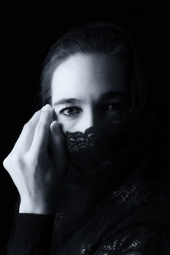 Middle Eastern woman portrait looking sad with black hijab artis
