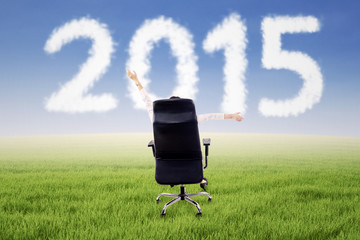 Woman on chair with number 2015