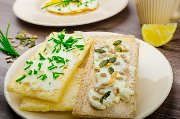 Crisp Crispbread with cheese spread with chives and seeds