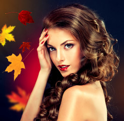Girl with colourful autumn leaves hairstyle and makeup