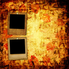 Old grunge torn frame on the ancient background with roses