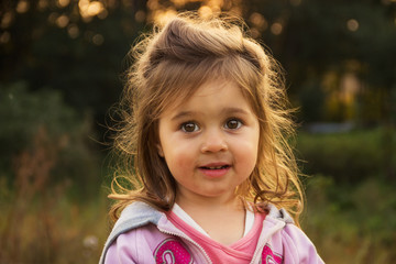 cute little kid surprised and looking with interest