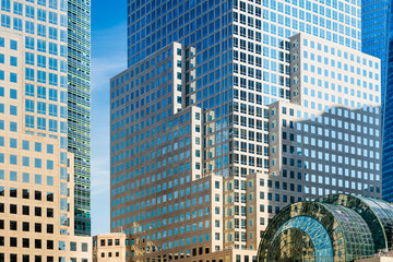 Obraz premium Detail of skyscrapers facade with windows in blue and yellow