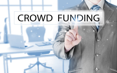 Businessman pushes virtual crowd funding button