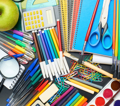 Desk covered with multiple stationery