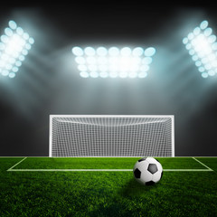 Soccer ball on green stadium arena