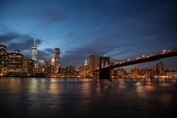 Skyline New York and Brooklyn bridge at night
