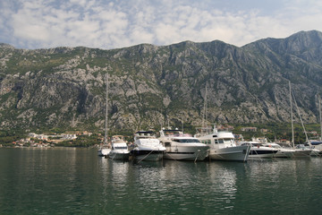 Fototapeta na wymiar Small yacht in the Bay of Kotor in Montenegro