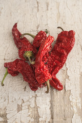 Red Sun-Dried Pepper a basket on wooden table