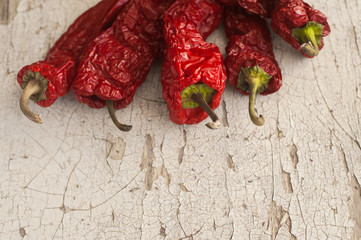 Red Sun-Dried Pepper a basket on wooden table