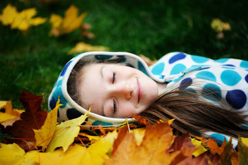 Happy little child in autumn park