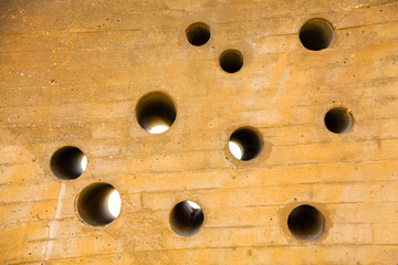 wall with a plurality of holes round