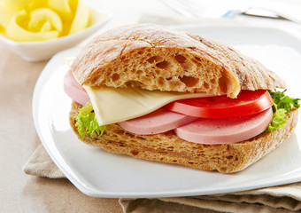 sandwich with sausage and tomato