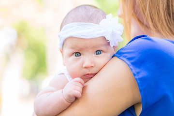 Beautiful mother and baby outdoor.