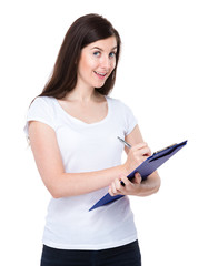 Fototapeta premium Caucasian woman write on clipboard