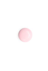 Pink supplement, isolated on white. Healthcare concept.