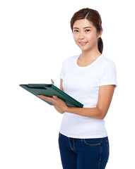 Fototapeta premium Asian woman write on clipboard