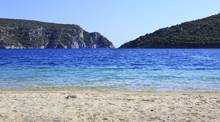 Fototapeta na wymiar Beach at Porto Koufo (bay of Aegean Sea).