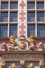 Fototapeta premium Architecture relief with two lions holding emblem of Gdansk