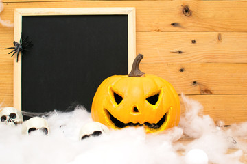 Halloween pumpkin with a blackboard