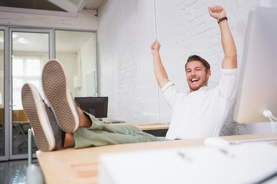 Cheerful Businessman Cheering In Office