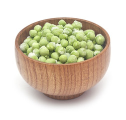 Frozen peas in a wooden bowl