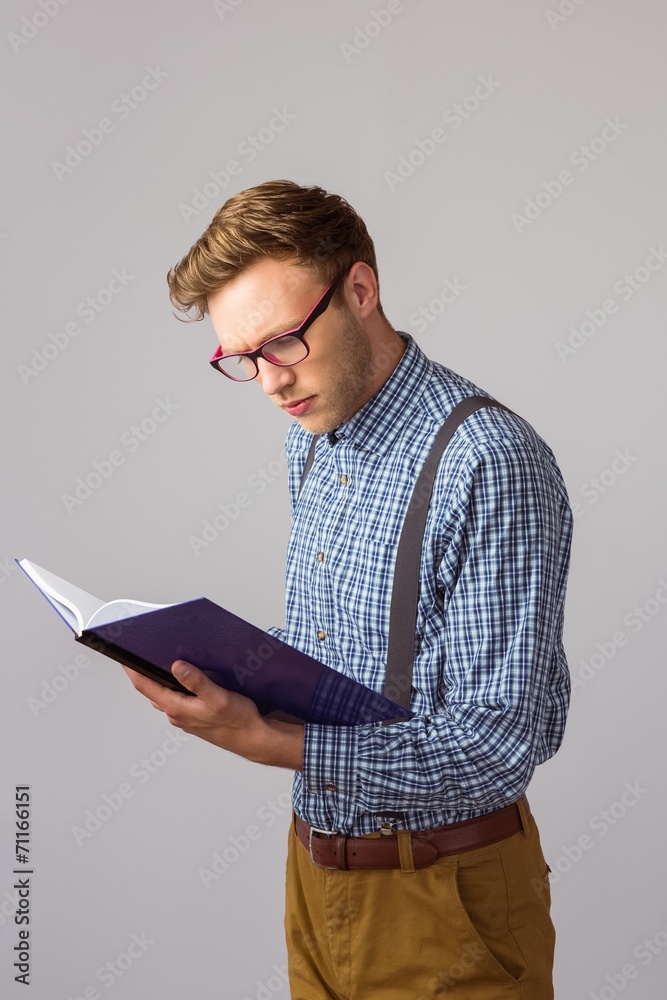 Poster geeky student reading a book