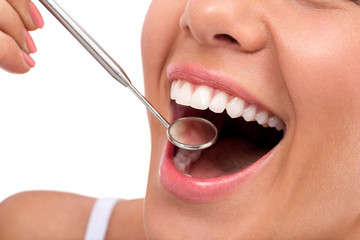 Smile with dentist mirror