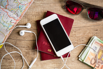 Wooden table with things for travel