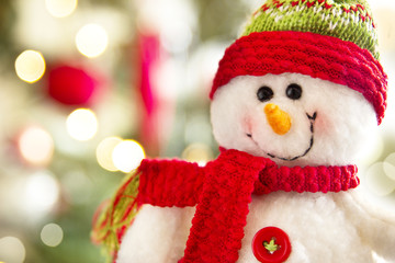 snowman against christmas lights