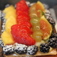 portion of delicious fruit cake in italian pastry shop